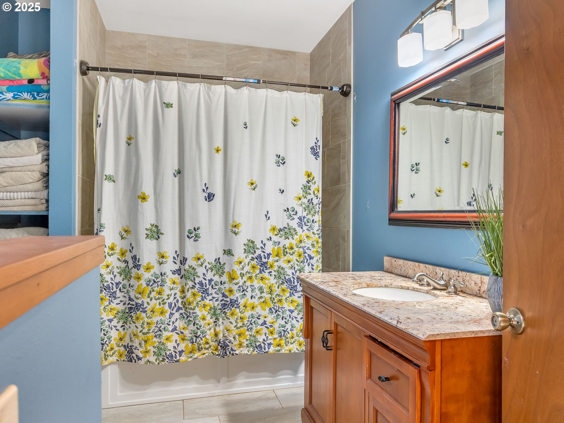 42274 Ziak-Gnat Creek Road Astoria, OR 97103 - Photo 12 of 48 a bathroom with a granite countertop sink and a mirror
