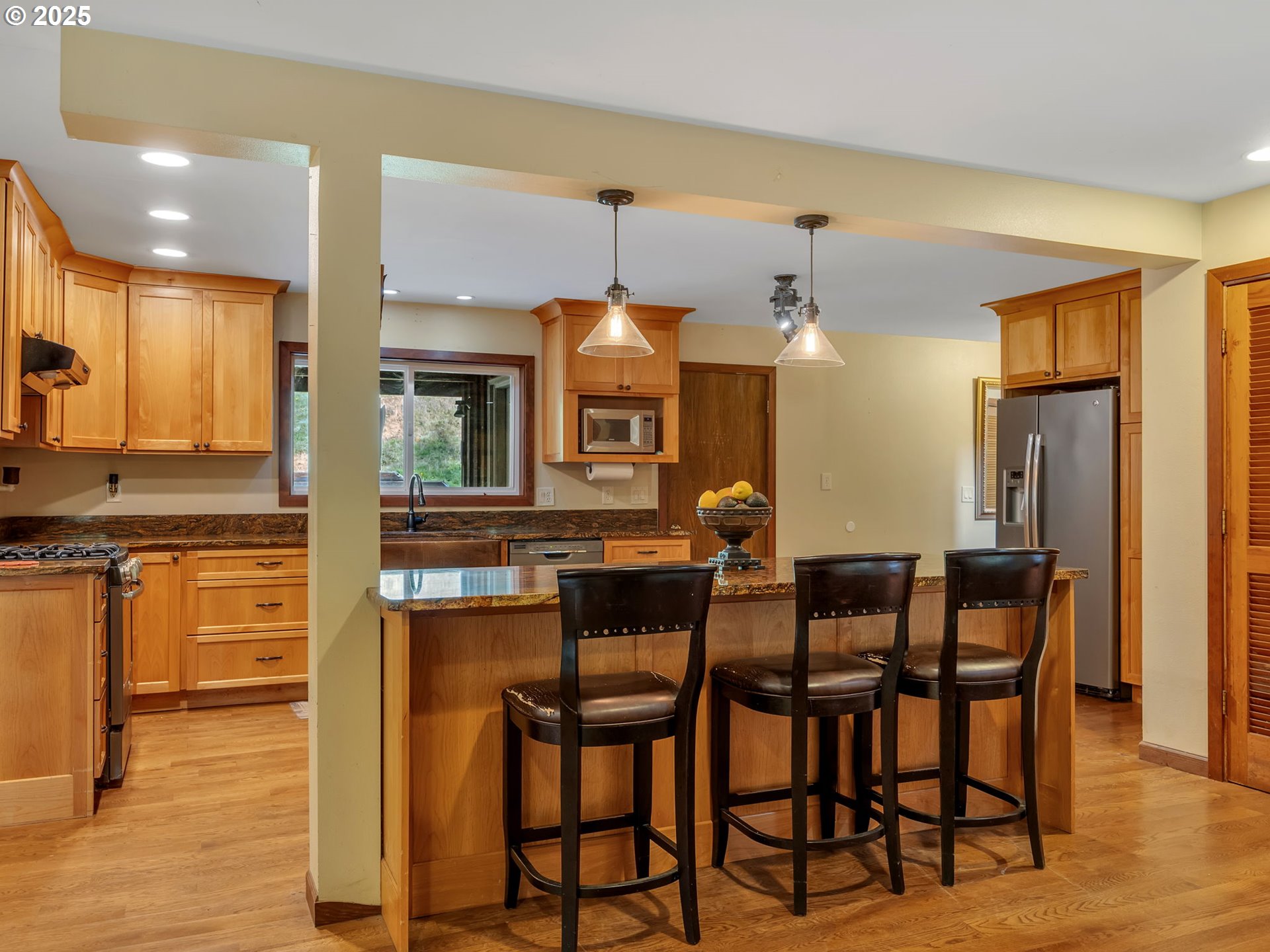 42274 Ziak-Gnat Creek Road Astoria, OR 97103 - Photo 19 of 48 a view of a dining room with furniture and wooden floor