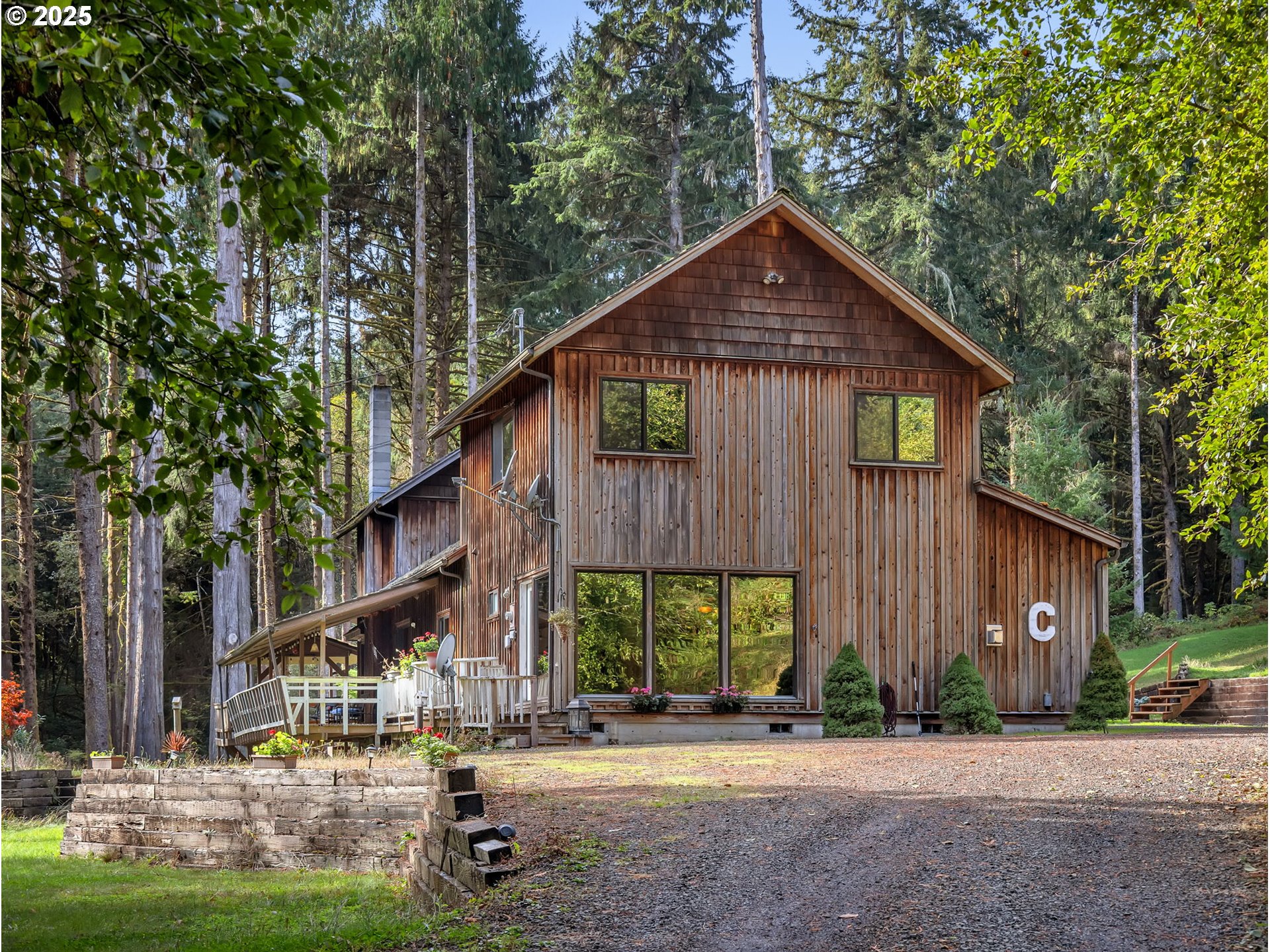 42274 Ziak-Gnat Creek Road Astoria, OR 97103 - Photo 2 of 48 a view of a house with backyard and trees
