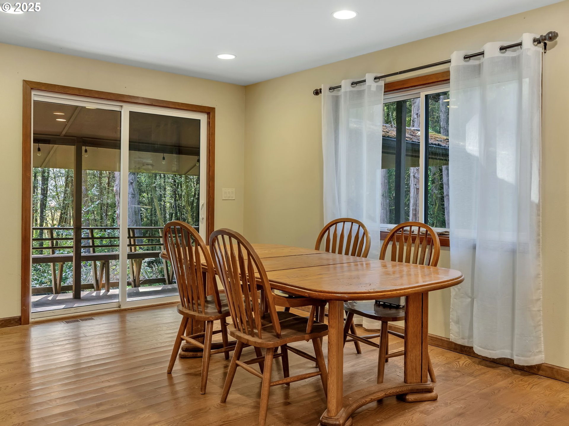 42274 Ziak-Gnat Creek Road Astoria, OR 97103 - Photo 21 of 48 a dining room with furniture window wooden floor