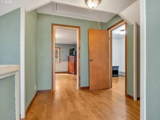 a bedroom with a large bed and a large window
