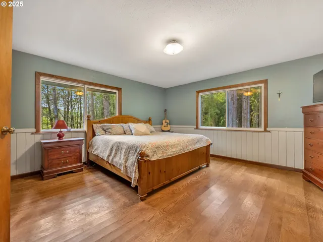 a bedroom with a large bed and a couch