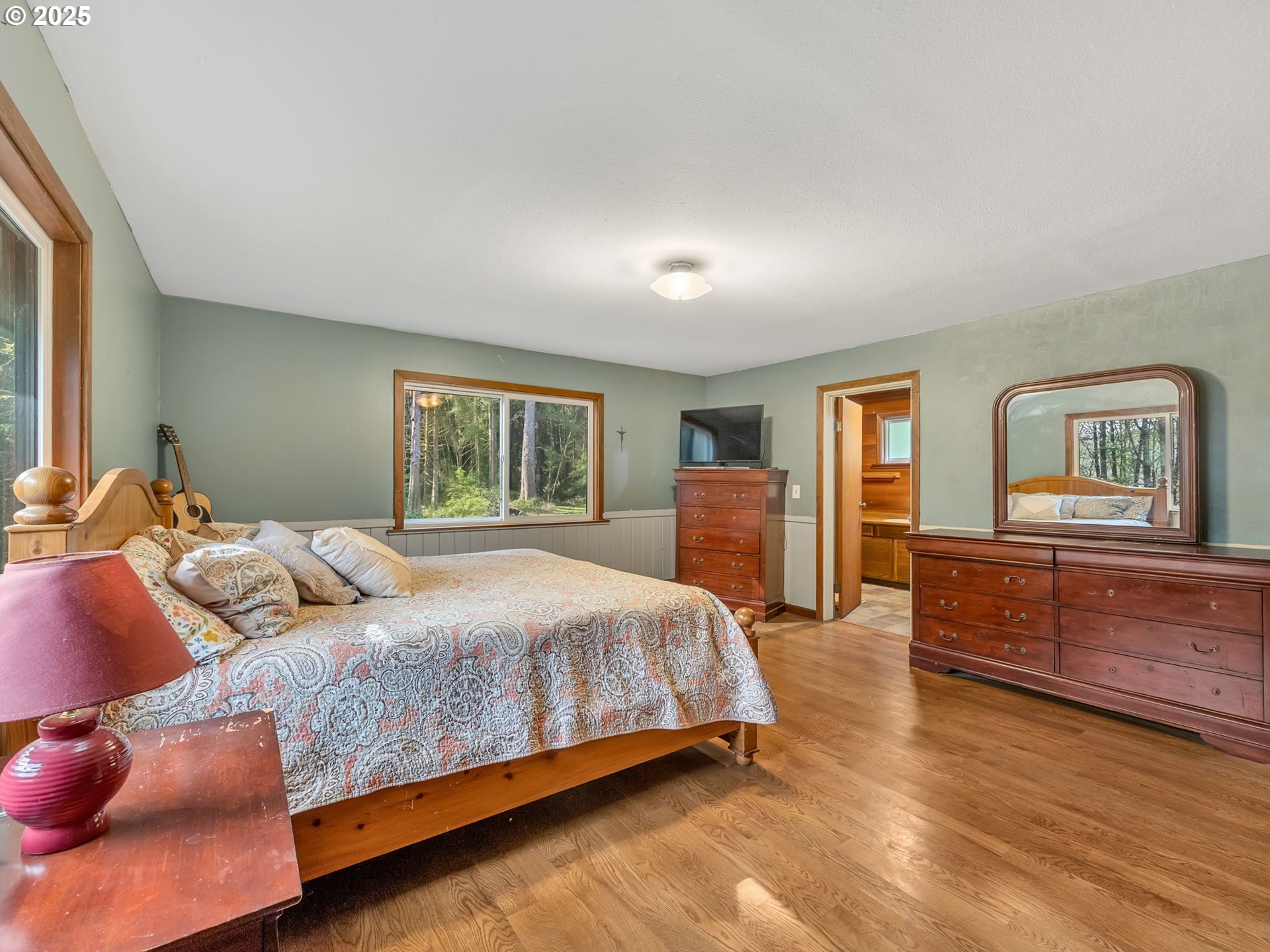 42274 Ziak-Gnat Creek Road Astoria, OR 97103 - Photo 28 of 48 a bedroom with a large bed and a couch