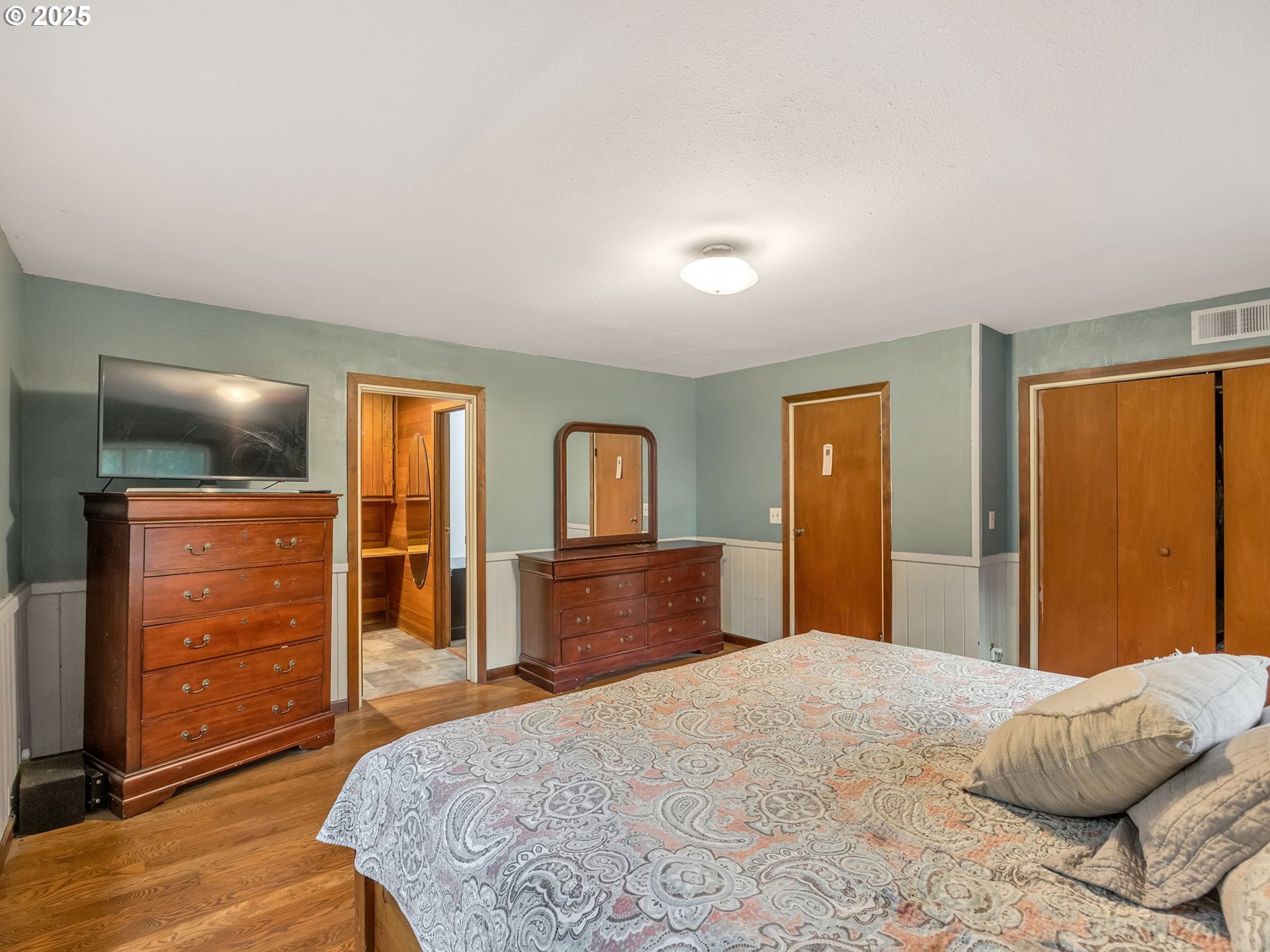 42274 Ziak-Gnat Creek Road Astoria, OR 97103 - Photo 30 of 48 a bedroom with a bed and a dresser