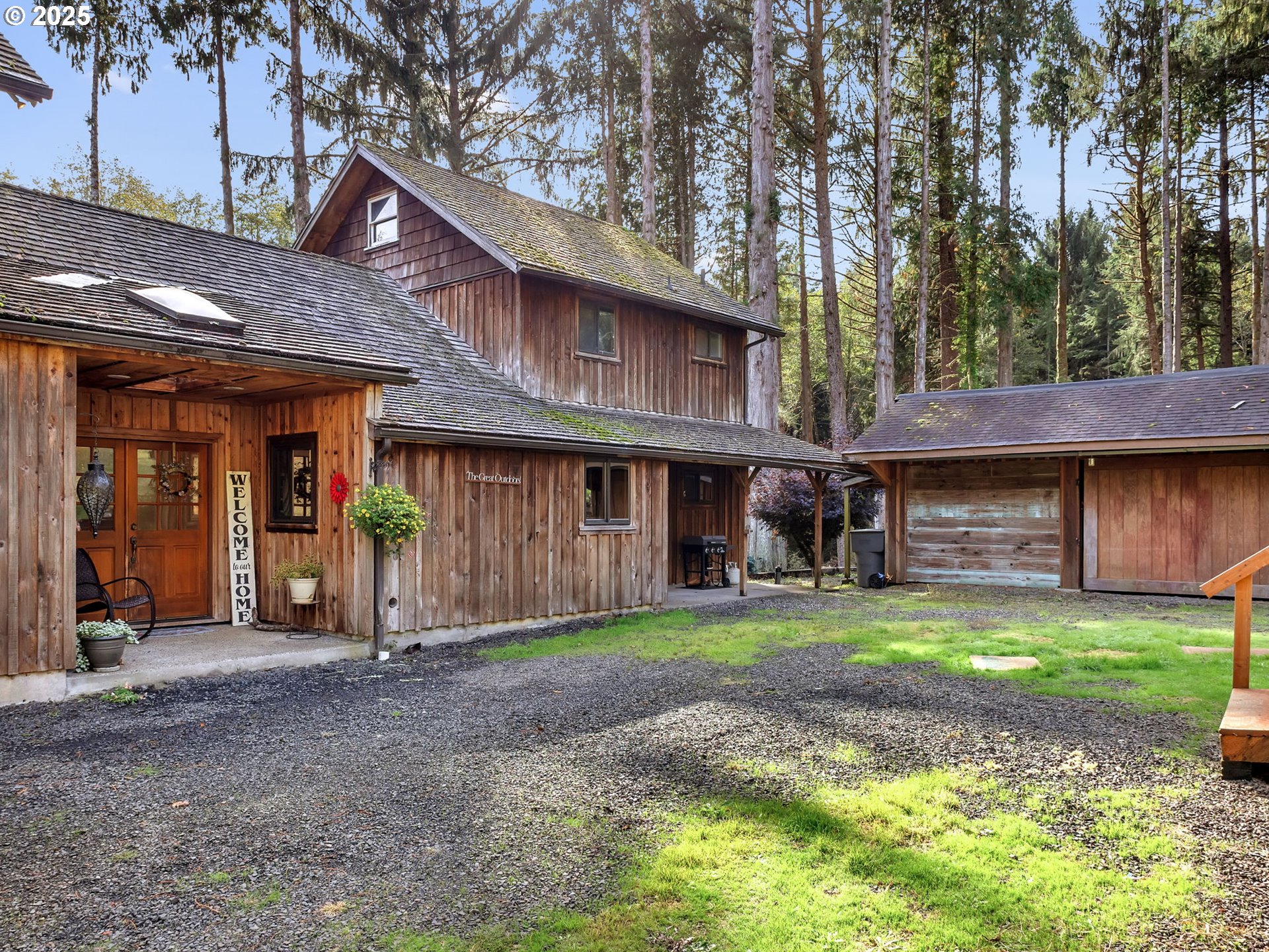 42274 Ziak-Gnat Creek Road Astoria, OR 97103 - Photo 3 of 48 a view of a house with a patio and a yard