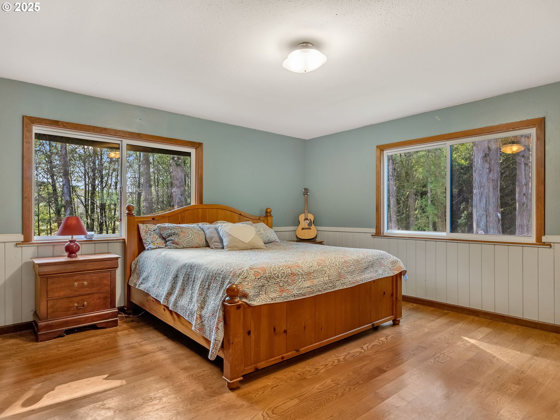 42274 Ziak-Gnat Creek Road Astoria, OR 97103 - Photo 31 of 48 a bedroom with a bed and a large window