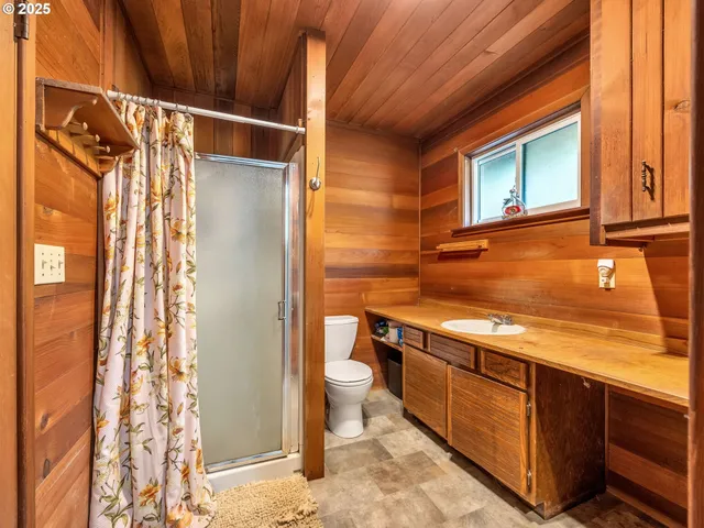 an empty room with entrance and windows