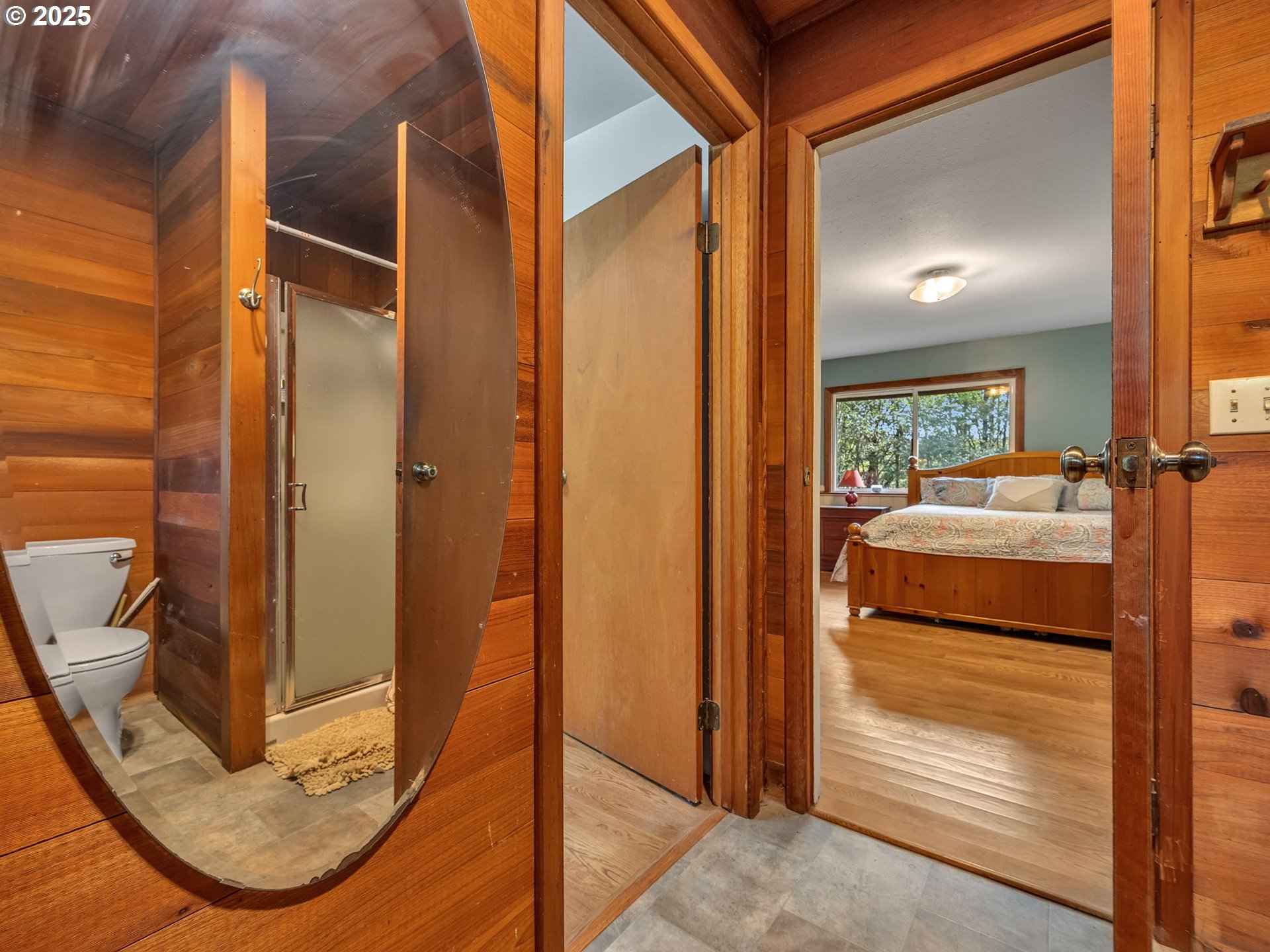 42274 Ziak-Gnat Creek Road Astoria, OR 97103 - Photo 34 of 48 a view of a hallway with wooden floor windows and a livingroom