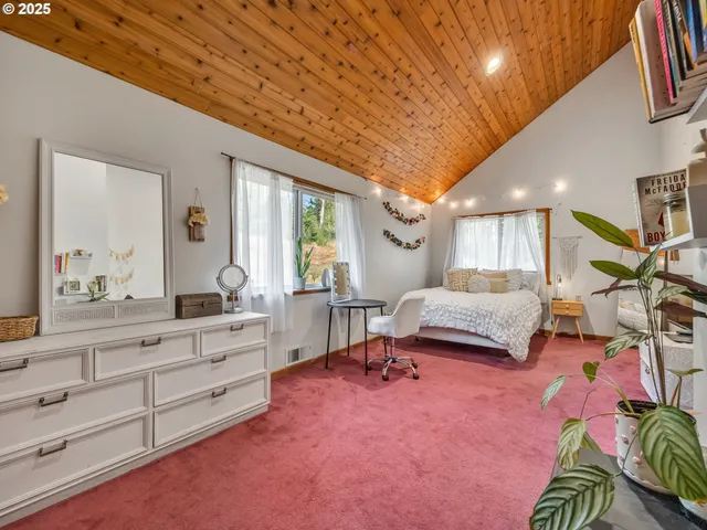 a bedroom with furniture and a window