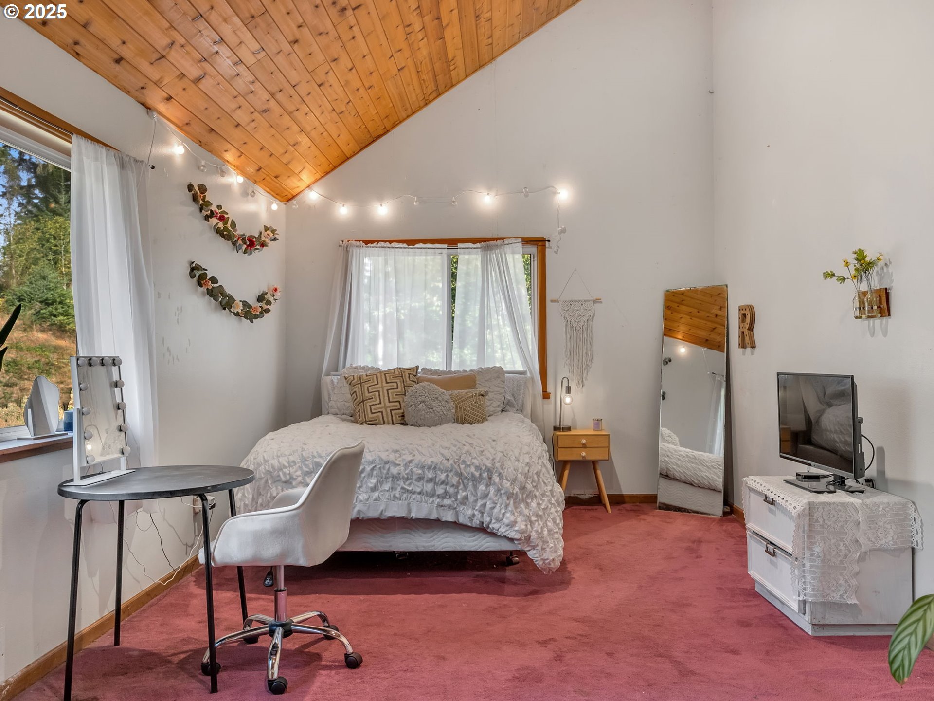 42274 Ziak-Gnat Creek Road Astoria, OR 97103 - Photo 36 of 48 a bedroom with furniture and a window