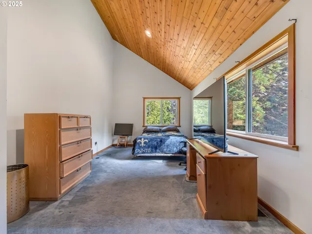 a bedroom with furniture and a window