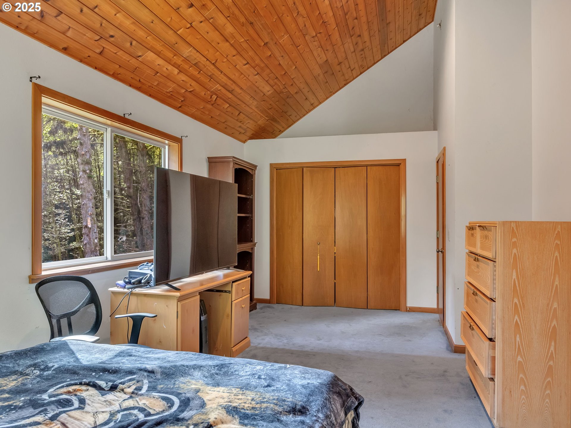 42274 Ziak-Gnat Creek Road Astoria, OR 97103 - Photo 39 of 48 a bedroom with furniture and a window