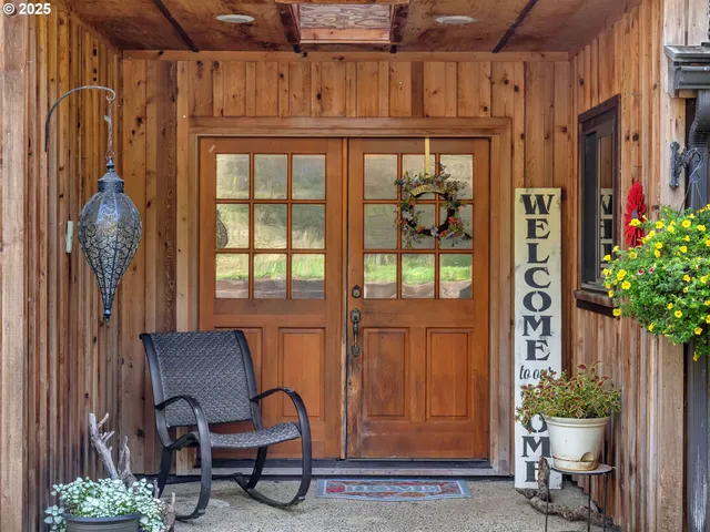 a view of a entryway with furniture and chandelier