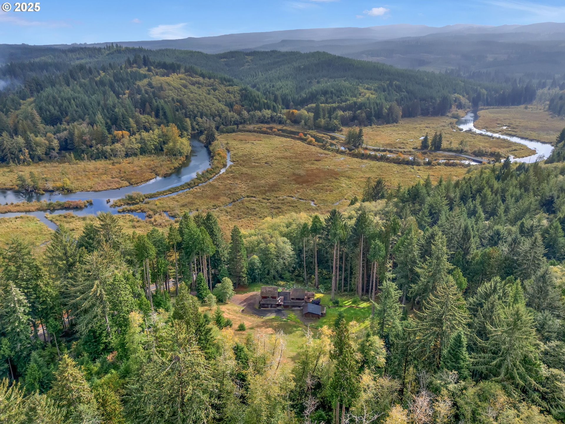 42274 Ziak-Gnat Creek Road Astoria, OR 97103 - Photo 44 of 48 a view of a lake with a mountain in the background