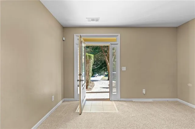 a view of an empty room with stairs