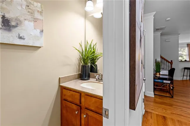 a view of bathroom with a sink and mirror