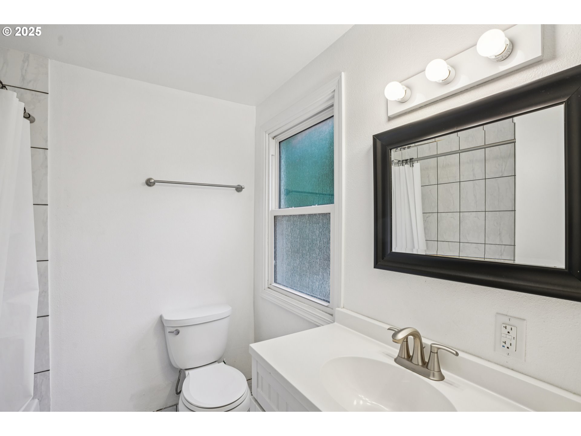 14806 Southeast Bush Street Portland, OR 97236 - Photo 17 of 33 a bathroom with a sink a toilet and mirror