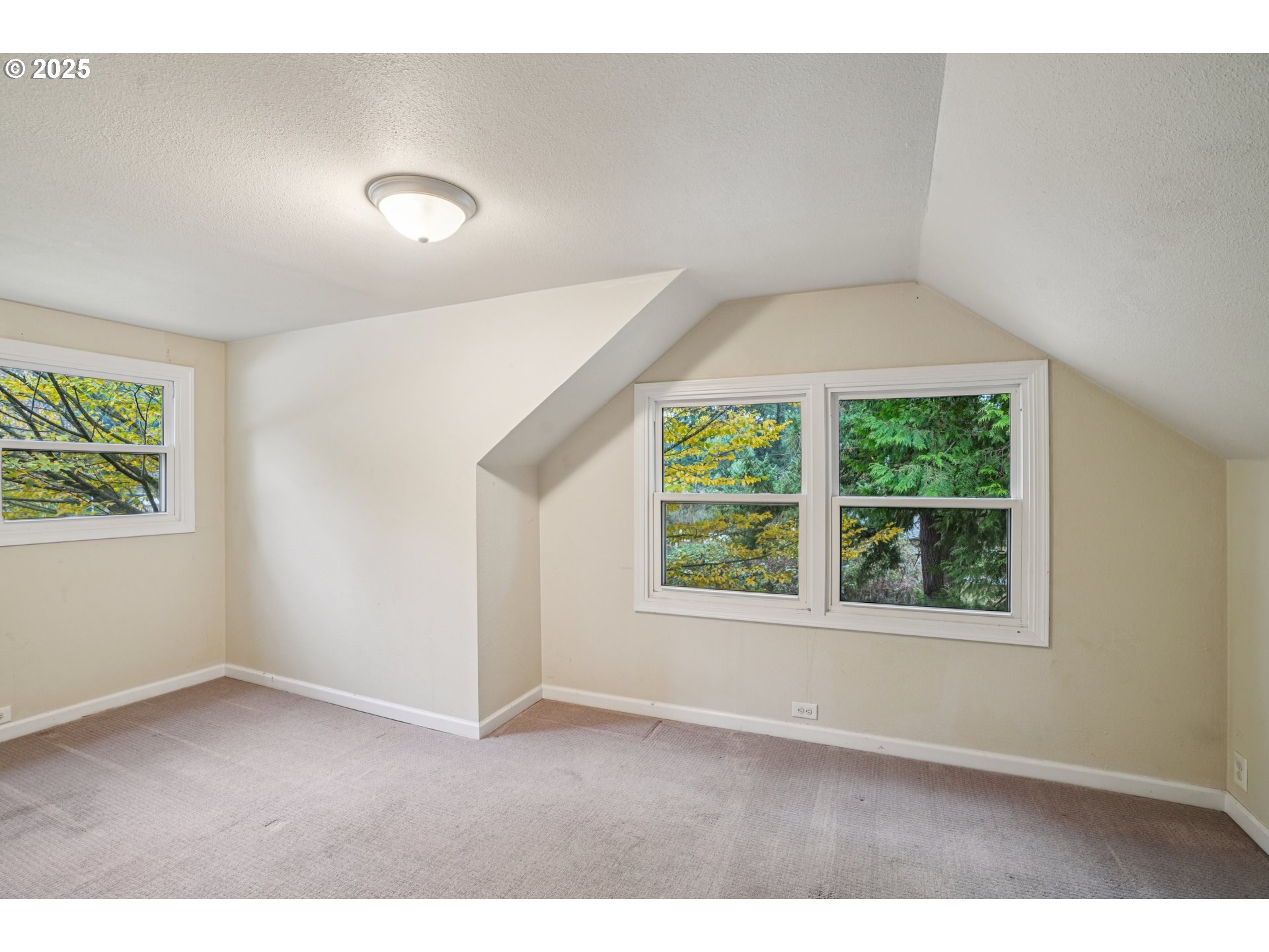 14806 Southeast Bush Street Portland, OR 97236 - Photo 18 of 33 an empty room with windows