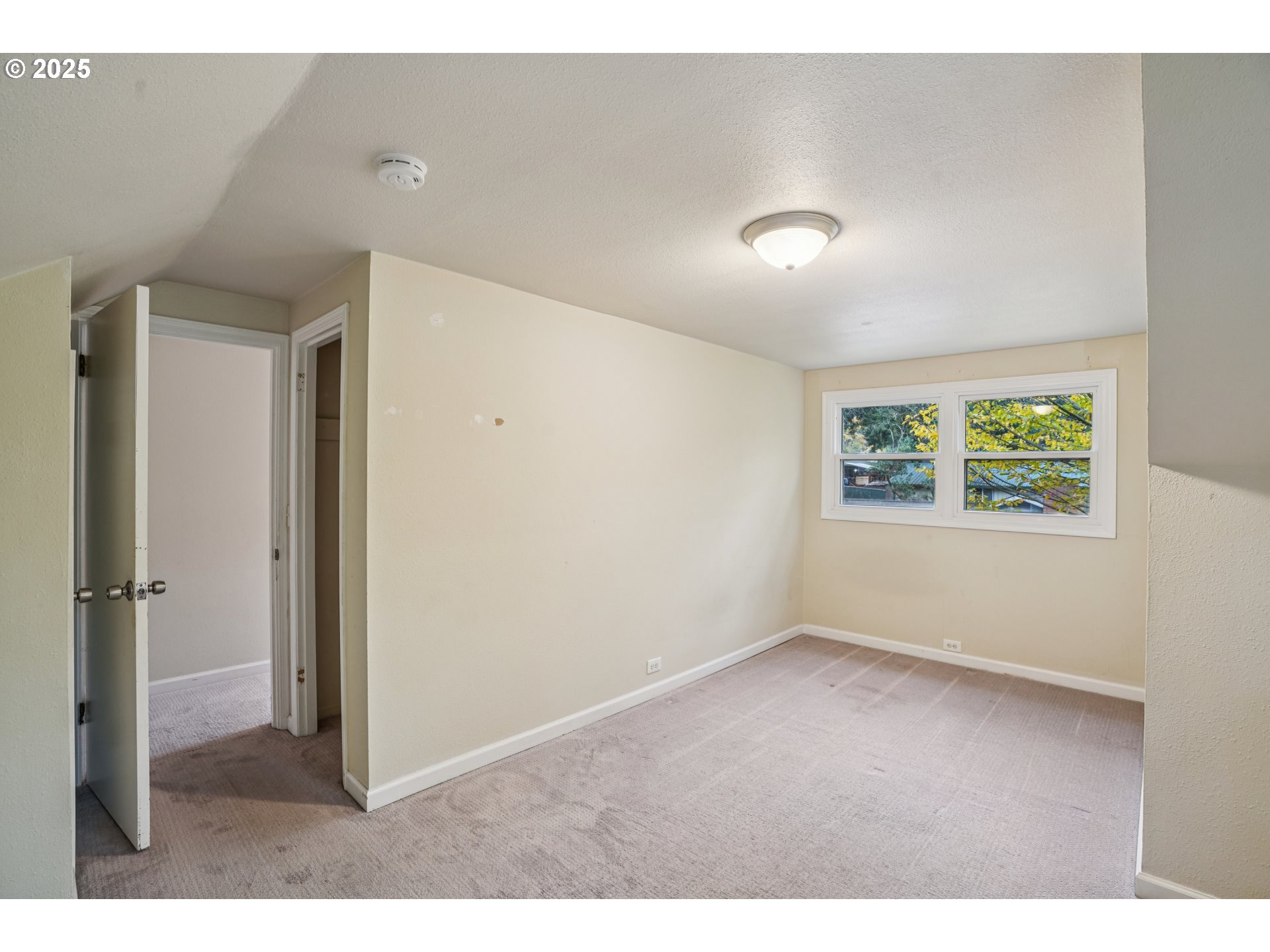 14806 Southeast Bush Street Portland, OR 97236 - Photo 19 of 33 an empty room with windows