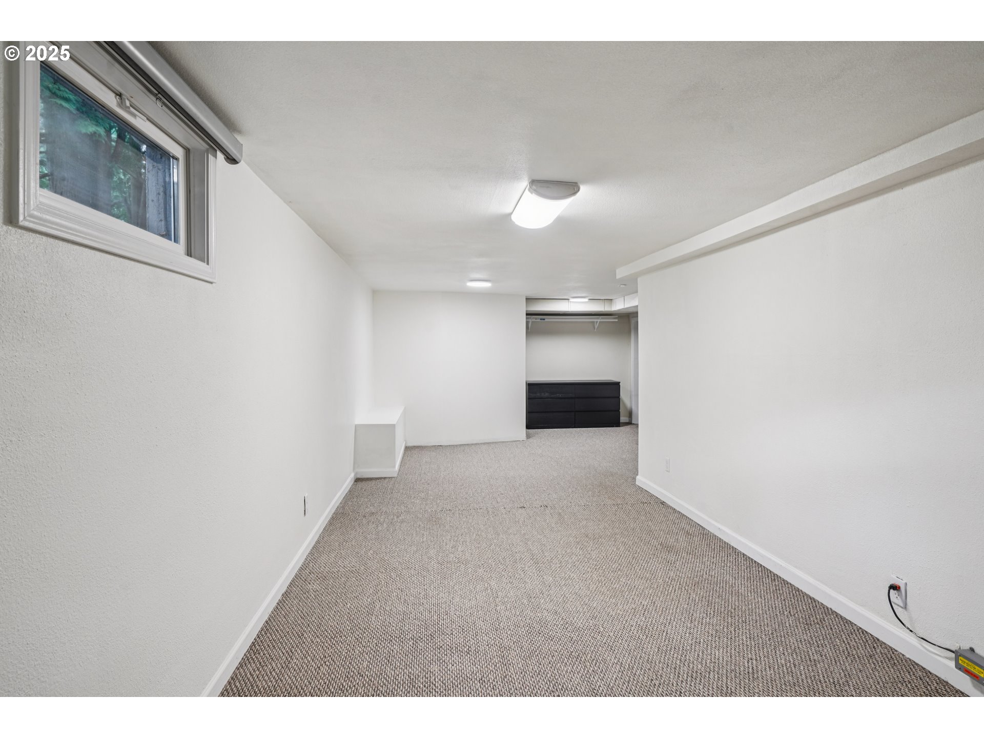 14806 Southeast Bush Street Portland, OR 97236 - Photo 25 of 33 a view of an empty room with a kitchen
