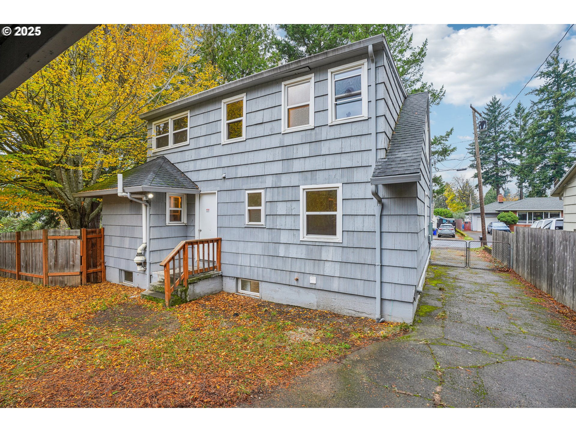 14806 Southeast Bush Street Portland, OR 97236 - Photo 27 of 33 a view of a house with a wooden fence