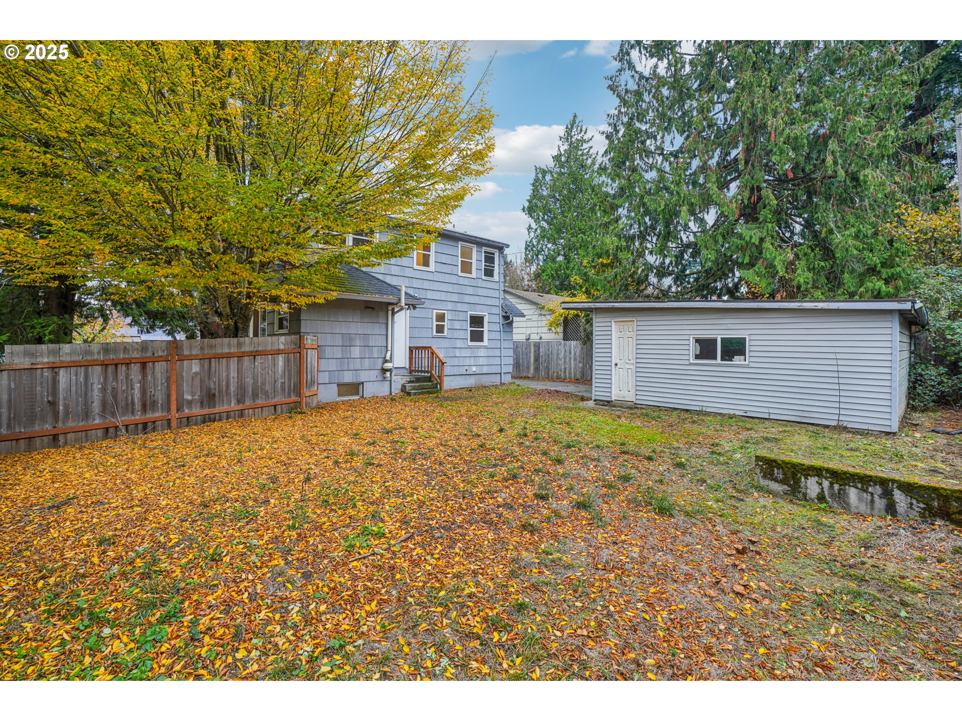 14806 Southeast Bush Street Portland, OR 97236 - Photo 29 of 33 a view of a house with a backyard