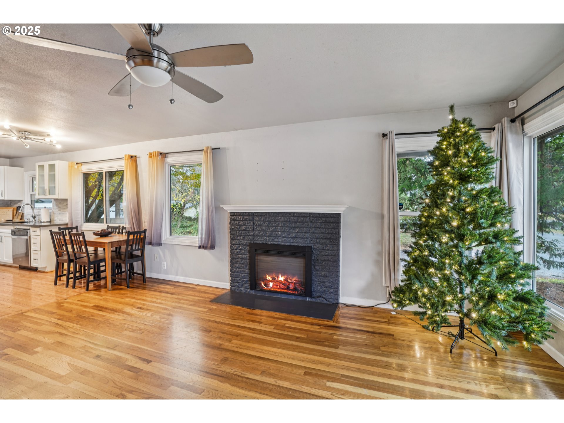 14806 Southeast Bush Street Portland, OR 97236 - Photo 3 of 33 a living room with furniture and a fireplace