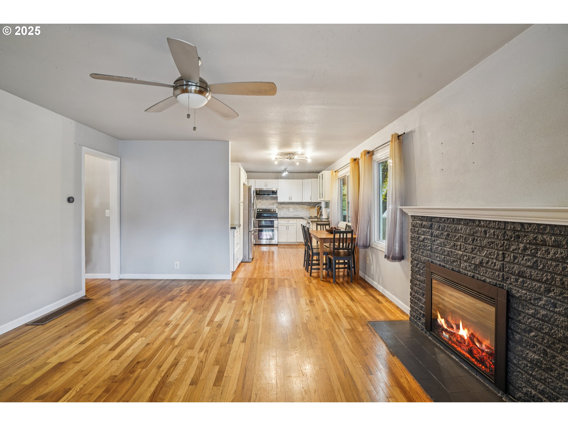 14806 Southeast Bush Street Portland, OR 97236 - Photo 4 of 33 a view of a livingroom with furniture and a fireplace