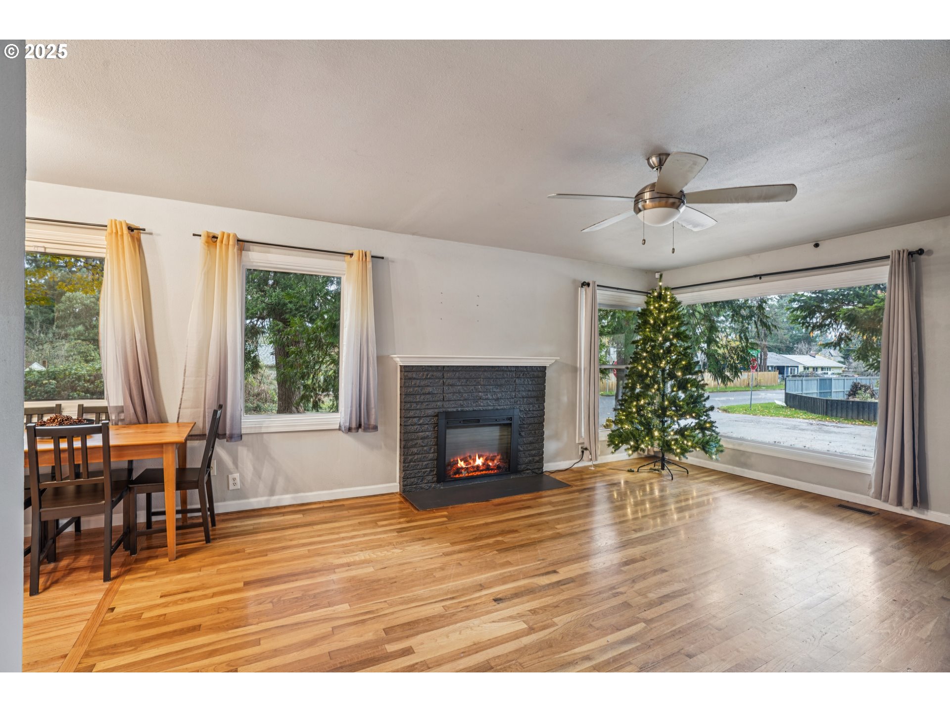 14806 Southeast Bush Street Portland, OR 97236 - Photo 5 of 33 a living room with furniture and a fireplace