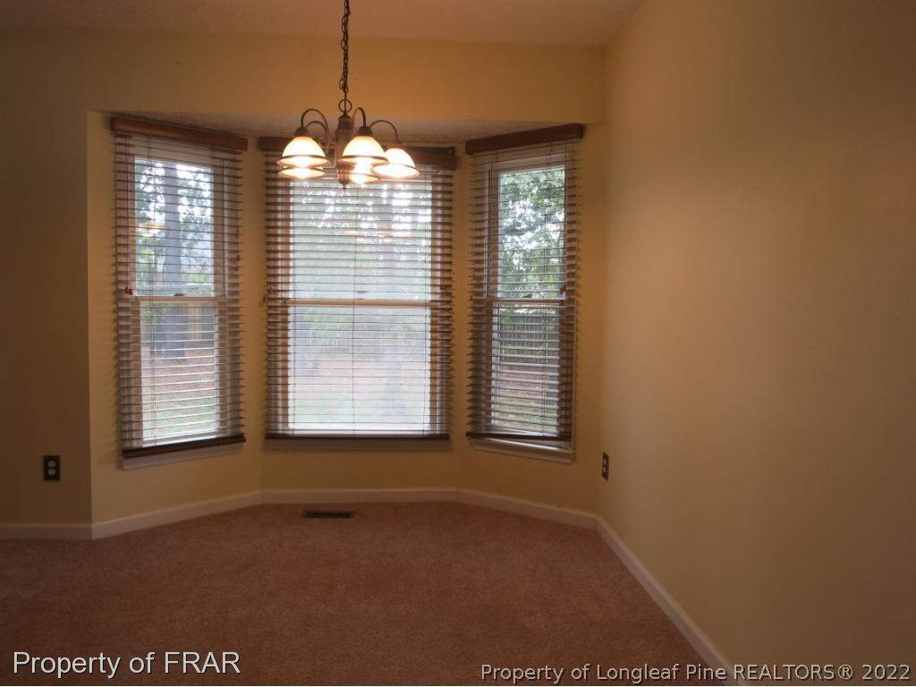6875 Green Creek Road Fayetteville, NC 28314 - Photo 11 of 26 a view of an empty room with a window