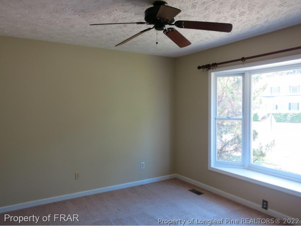 6875 Green Creek Road Fayetteville, NC 28314 - Photo 13 of 26 a view of room with window and ceiling fan