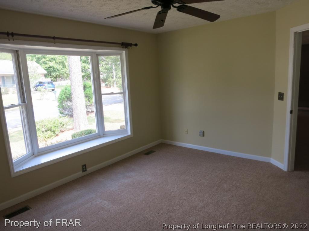 6875 Green Creek Road Fayetteville, NC 28314 - Photo 14 of 26 a view of an empty room with a window