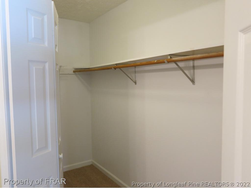 6875 Green Creek Road Fayetteville, NC 28314 - Photo 17 of 26 a view of an empty walk in closet