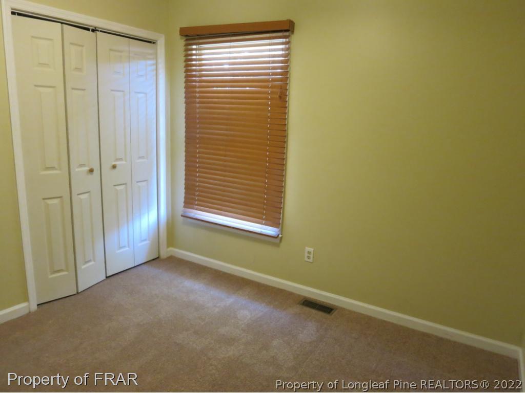 6875 Green Creek Road Fayetteville, NC 28314 - Photo 19 of 26 a view of an empty room with a window