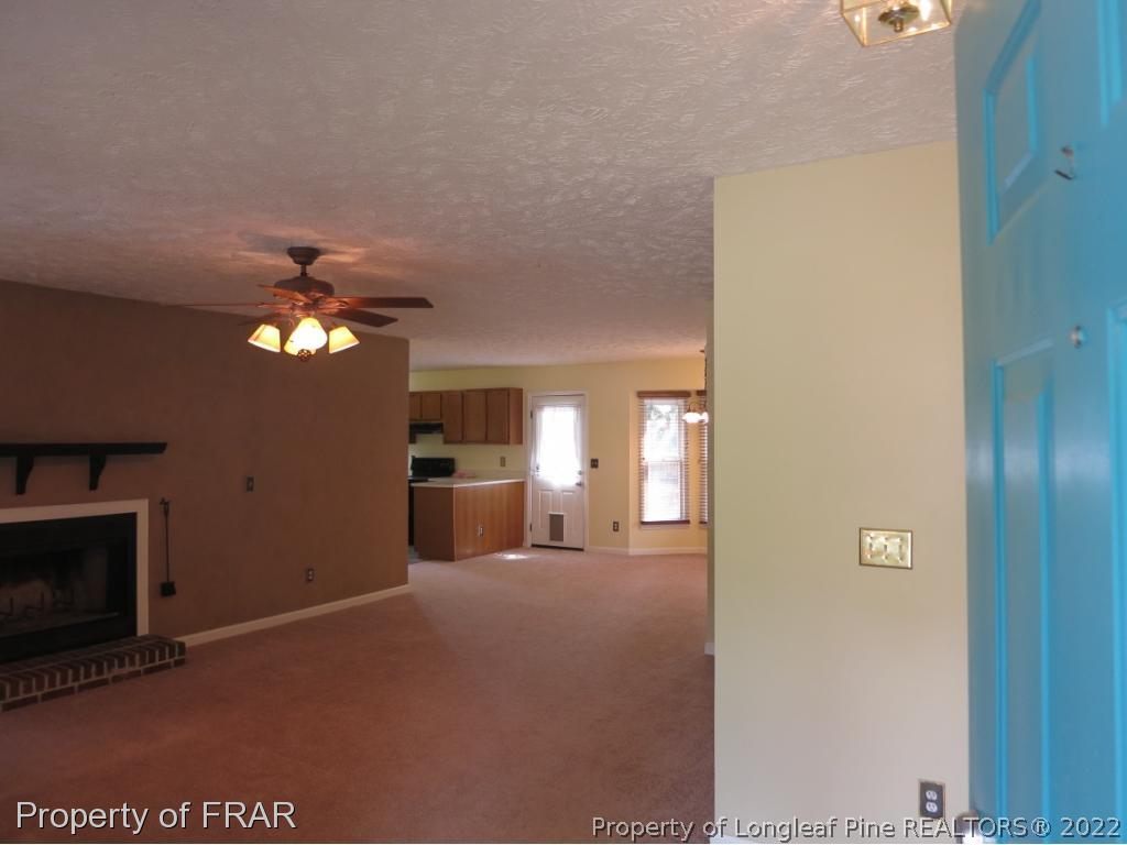 6875 Green Creek Road Fayetteville, NC 28314 - Photo 25 of 26 a view of a livingroom with a fireplace