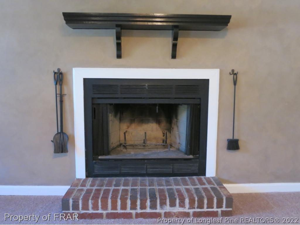 6875 Green Creek Road Fayetteville, NC 28314 - Photo 5 of 26 a view of fireplace with a wooden floor
