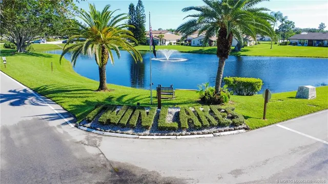 a view of a street with benches in the back yard