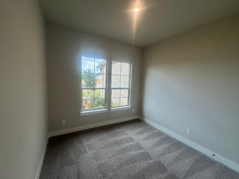 412 Indian Crk Road Van Alstyne, TX 75495 - Photo 22 of 24 an empty room with a window