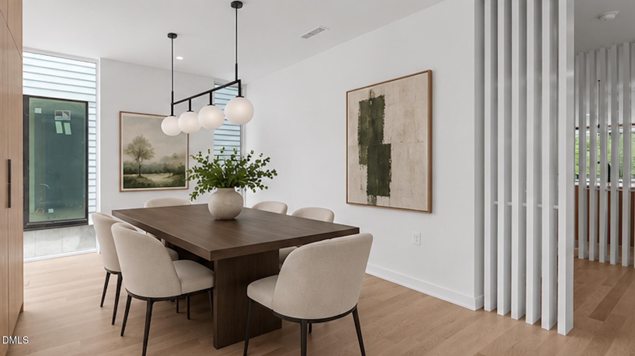 501 South Bloodworth Street, Unit 105 Raleigh, NC 27601 - Photo 16 of 59 a dining room with furniture and window