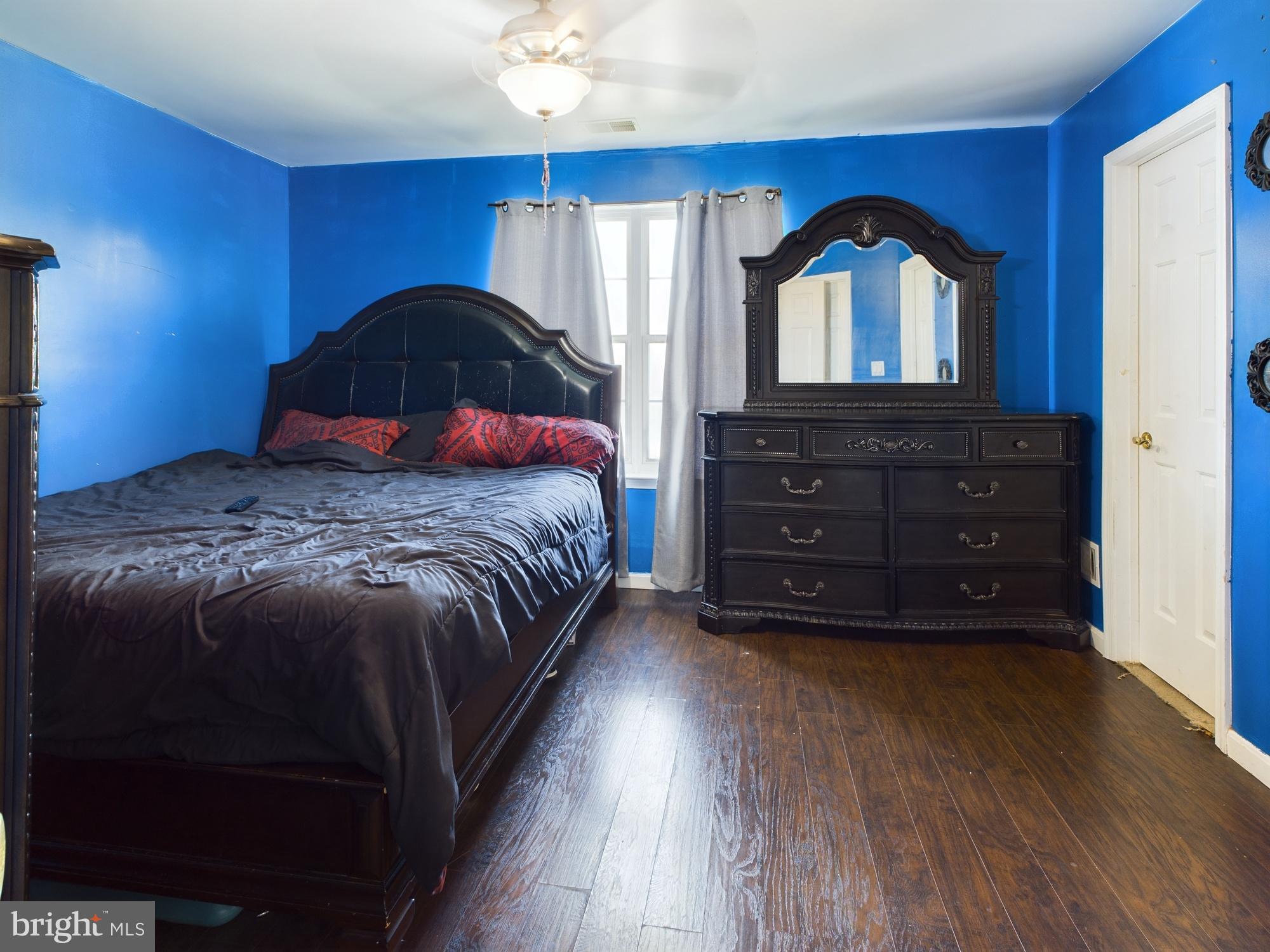 9620 Button Buck Circle Randallstown, MD 21133 - Photo 16 of 32 a bedroom with a bed a dresser and window