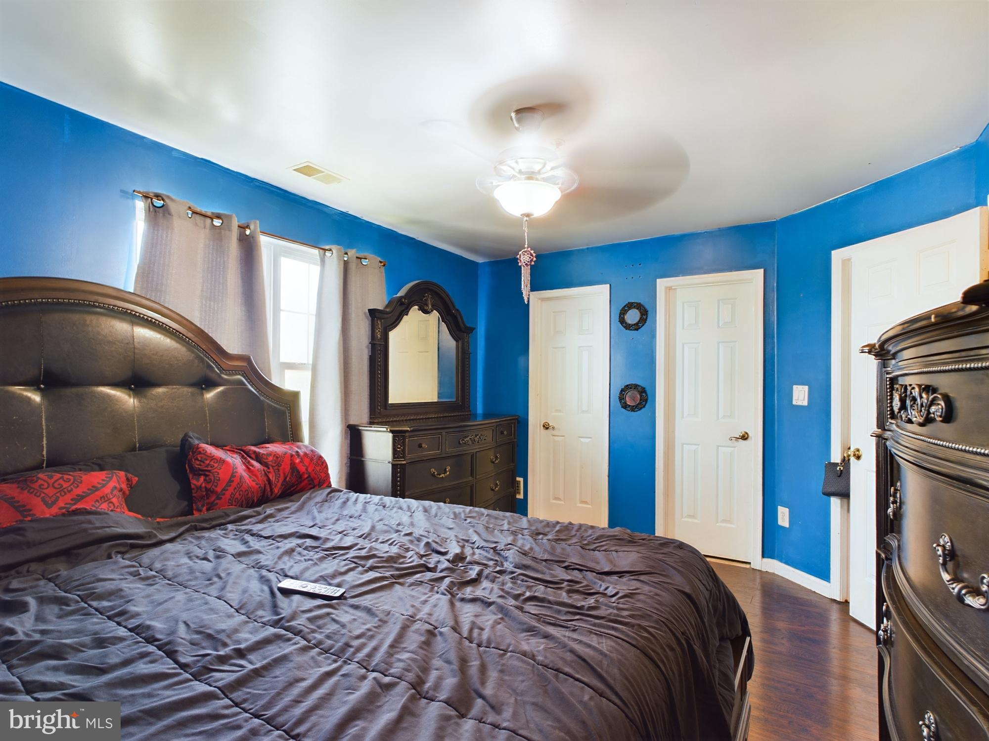 9620 Button Buck Circle Randallstown, MD 21133 - Photo 17 of 32 a bedroom with a large bed and a large closet