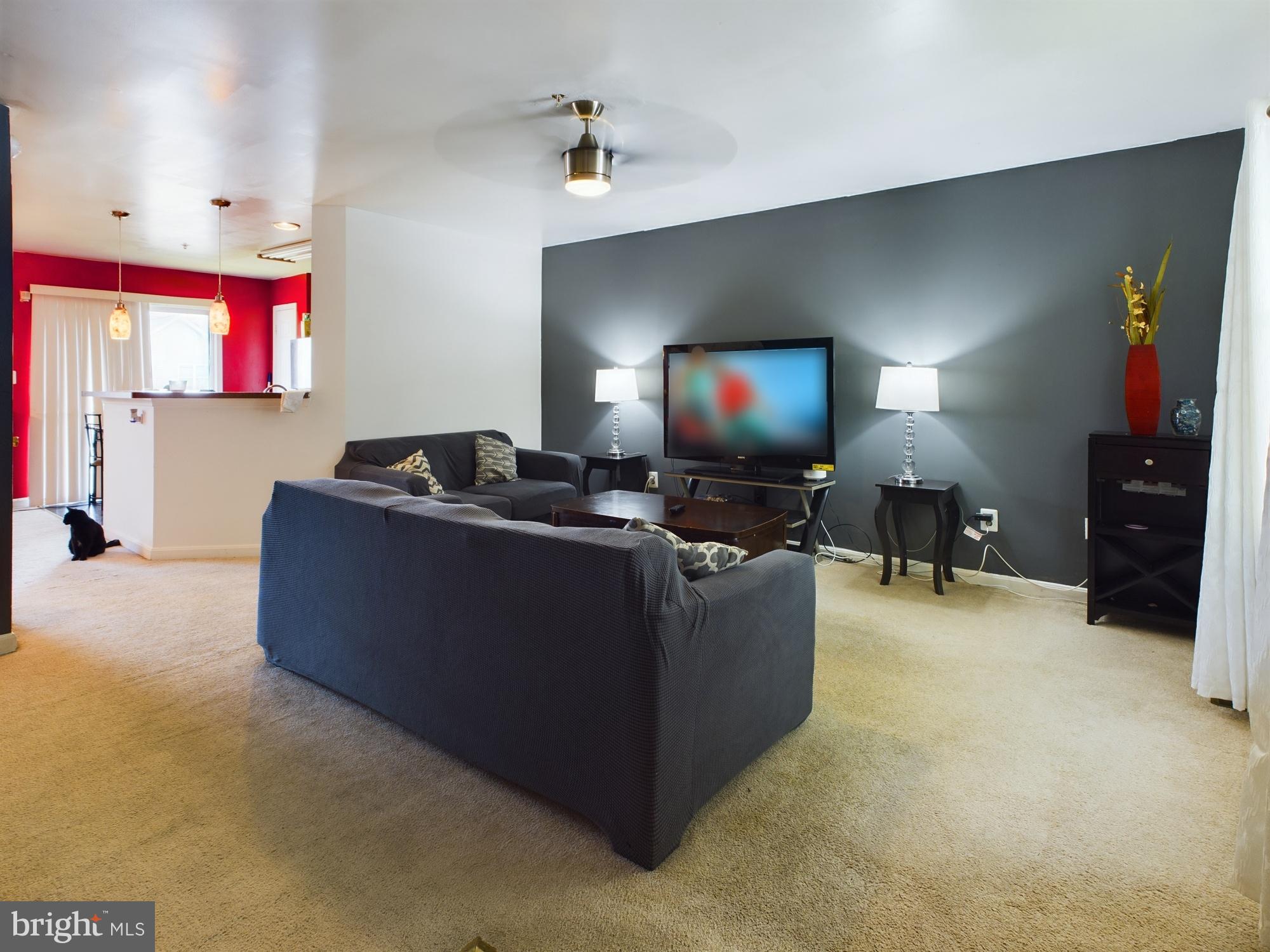 9620 Button Buck Circle Randallstown, MD 21133 - Photo 3 of 32 a living room with furniture and a flat screen tv