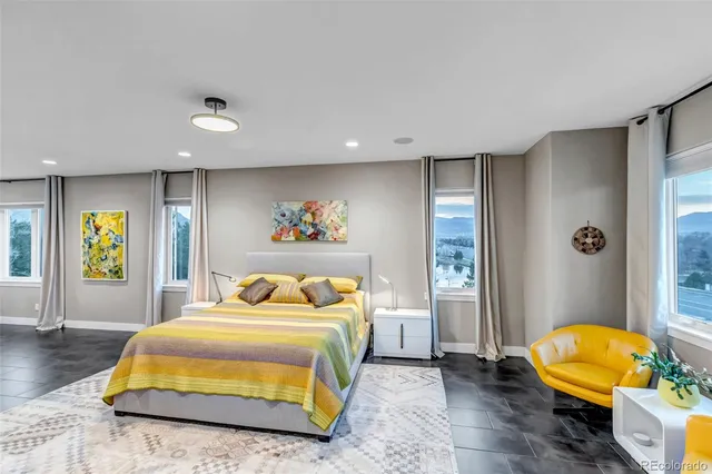 a bedroom with a bed and a couch