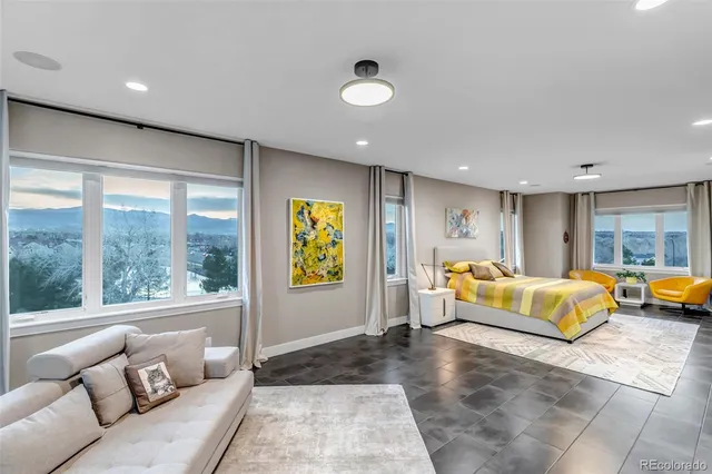 a living room with furniture and large window