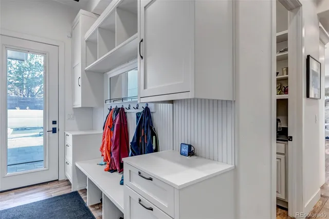 a view of walk in closet with clothes