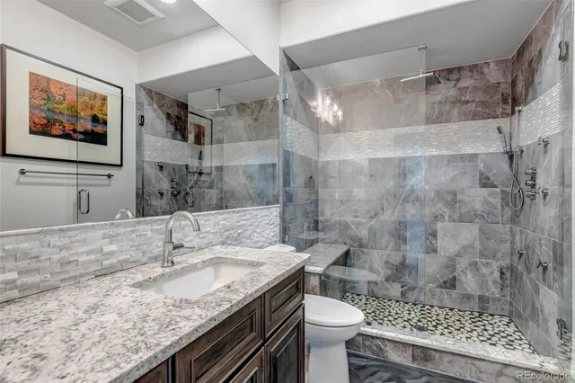 a view of a workspace with furniture and a workspace