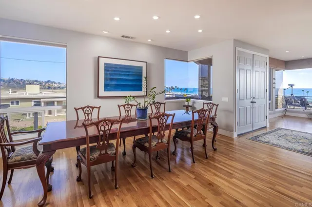 a view of a dining area with furniture and wooden floor