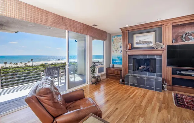 a living room with furniture fireplace and flat screen tv