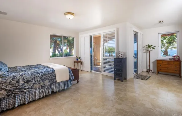 a bedroom with a bed and a cabinets