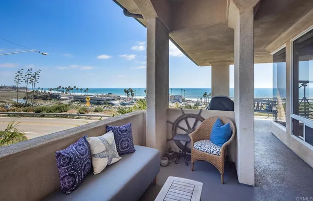 a outdoor living space with furniture and a floor to ceiling window